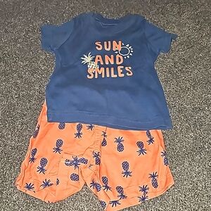 9 month shorts and short sleeved shirt. Pineapple themed.